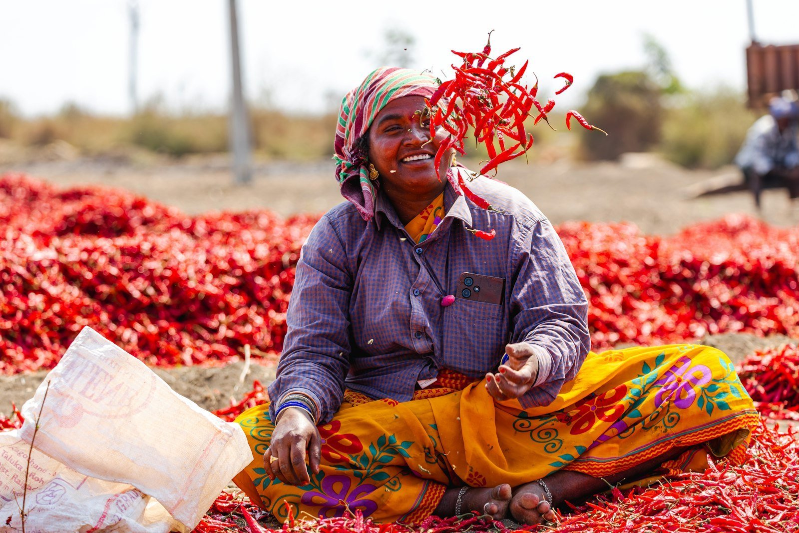 Woman farmer with red chillies